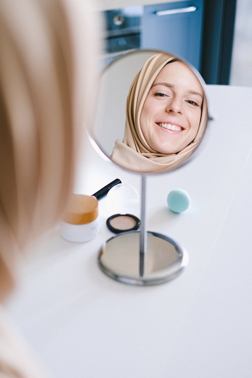 woman in brown hijab smiling