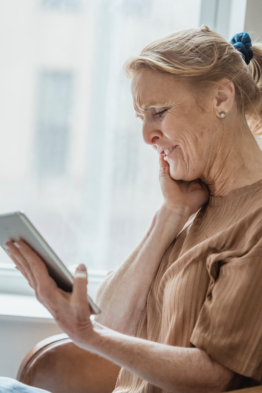 an eldery woman reading a book
